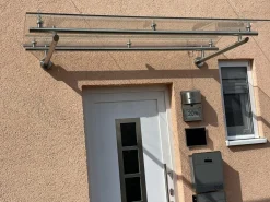 Vordach aus Edelstahl Modell Elegance mit VSG-TVG Türvordach Wetterschutz Überdachung