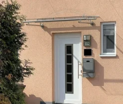Vordach aus Edelstahl Modell Elegance mit VSG-TVG Türvordach Wetterschutz Überdachung