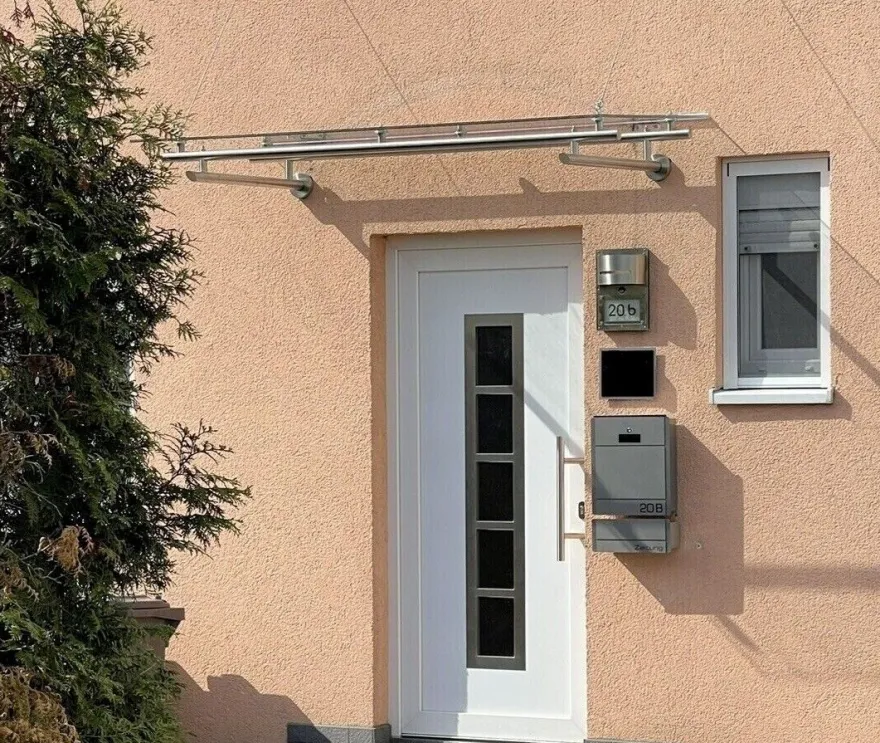 Vordach aus Edelstahl Modell Elegance mit VSG-TVG Türvordach Wetterschutz Überdachung