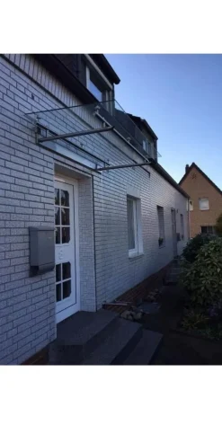 Vordach aus Edelstahl Modell Elegance mit VSG-TVG Türvordach Wetterschutz Überdachung